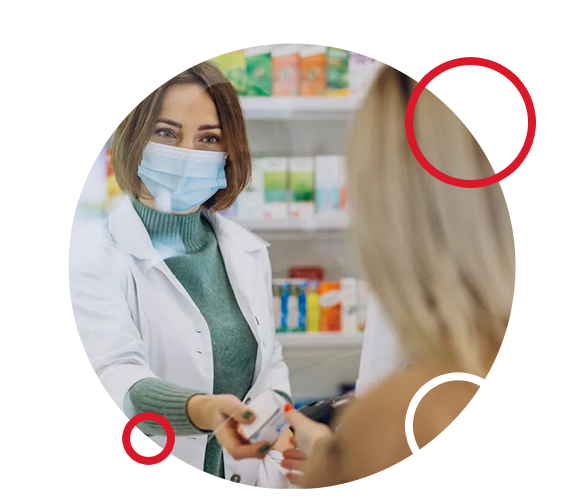 Pharmacist serving customer at drug store